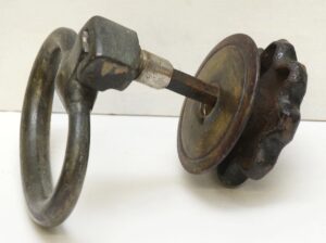 Pair of cast iron drop ring drawer pulls with a traditional castle-style backplate, shown together as a pair with mounting screws included.