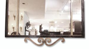 Rectangle wall mirror with a black frame and gold fleur-de-lis scroll detail at the bottom.