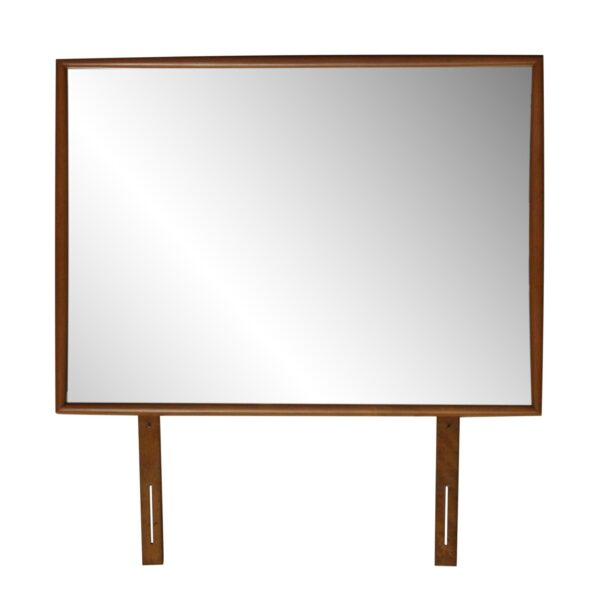 Rectangular dresser top mirror with a medium wood tone frame and two vertical support legs.