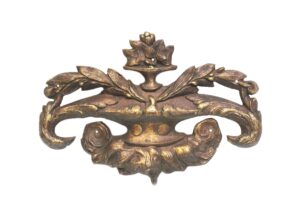 Ornate antique bronze urn applique with leaf motifs and a central pedestal urn shape.