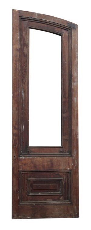 Single slanted arch door in dark wood tone with two panels and a large missing glass opening.