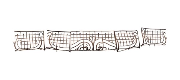 Art Nouveau wrought iron wrapping balcony shown as a wide curved railing with a central section and multiple matching extensions arranged side by side.