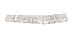 Art Nouveau wrought iron balcony railing with a curved central section and matching side extensions arranged in a wide set.
