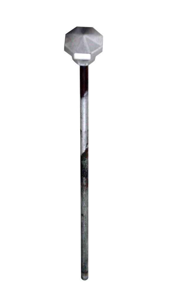 Art Deco drain rod stopper with a faceted head and long rod, shown in a straight-on view.