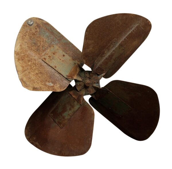 Rusty metal fan blade with four curved blades and a central hub.