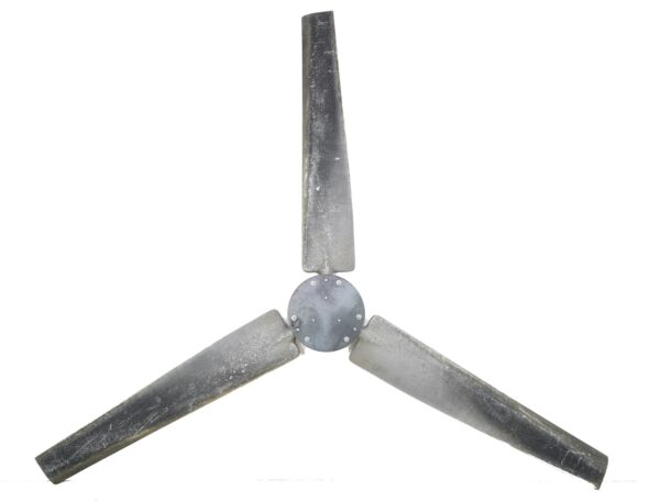 Three-blade fan propeller with a central hub, shown front on and made of reclaimed steel and aluminum with visible rust and wear.