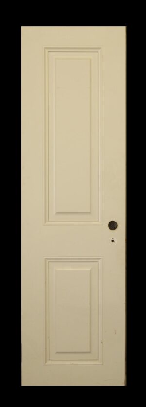 White wooden two-panel door shown frontally, with a round hardware opening on the right side.