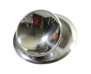 Concave chrome cabinet knob with matching plate, shown in a close-up angled view.