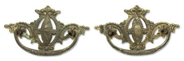 Pair of antique brass Victorian bail drawer pulls with ornate beaded detail, shown as a matching pair.