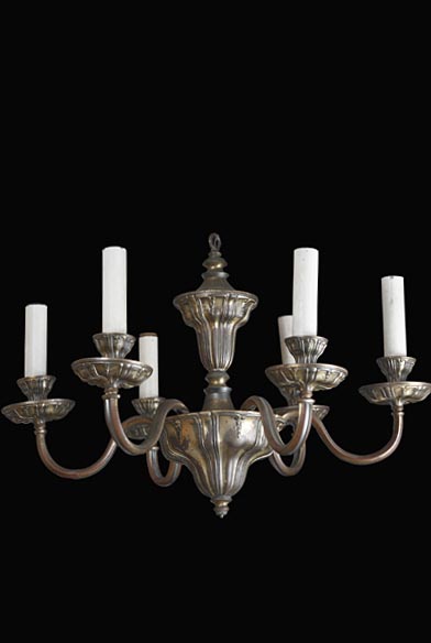 Georgian-style brass chandelier with six scrolling arms and candlestick-style sockets.