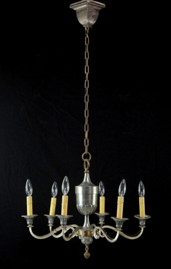 1940s Federal six-arm chandelier with an urn-shaped body, chain suspension, and clear candle-style bulbs.