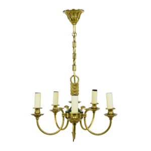 French Empire five-arm chandelier in antique brass with a green central accent and candle-style bulb holders.