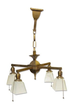 Traditional four-arm chandelier with antique brass finish and square frosted glass shades, shown hanging vertically.