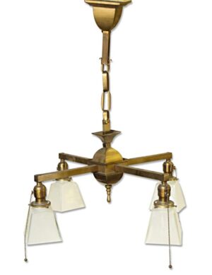 Traditional four-arm chandelier with brass arms and frosted glass shades, shown hanging vertically.