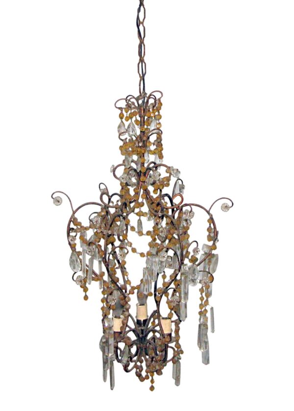 Victorian-style three-arm chandelier with amber beads and clear crystal prisms, shown in a front view.