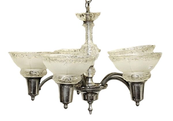 Art Deco five-light chandelier with glass shades and a chrome finish frame.