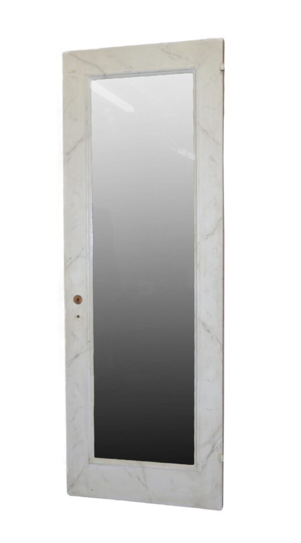 Tall mirrored closet door with a white-painted frame and a single full-length mirror panel.