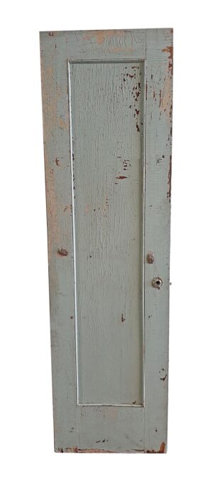 Narrow wooden closet door painted crackled green with one long vertical mirrored panel and one wood panel.