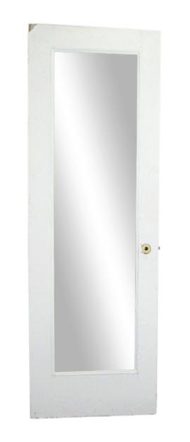 White wood closet door with a single full-length mirror pane and a visible mortise lock hole.