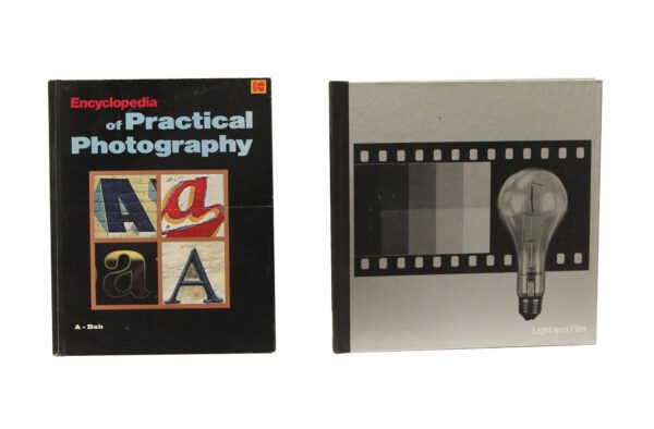 Two vintage photography books are shown, one black cover titled Encyclopedia of Practical Photography and one gray cover with a filmstrip and light bulb design, both from a 23-book set.