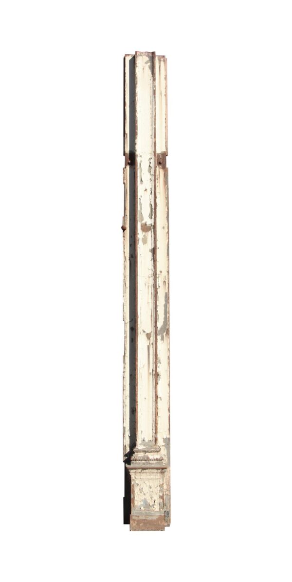 A tall white painted steel pilaster with an ornate base is shown in vertical profile, with chipped paint and weathered details.