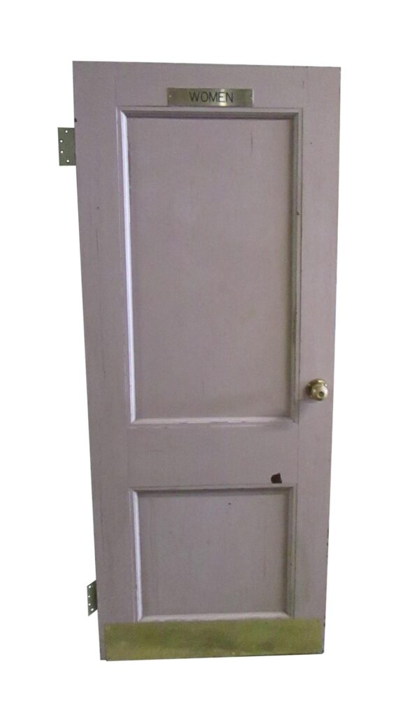 Two-panel women’s room door with a kick plate and WOMEN sign at the top, shown with a door knob on the right side.