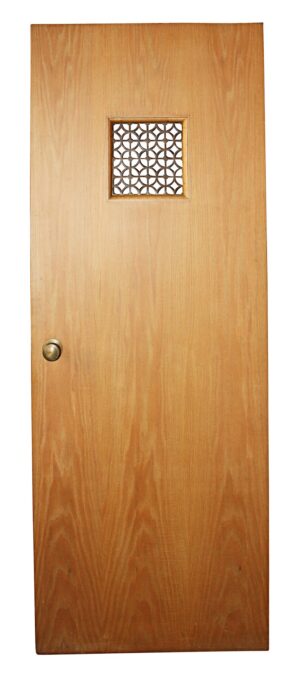 Single oak passage door with one brass grill panel near the top and a knob on the left side.