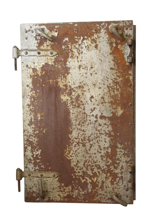 Single cast iron fire door with a heavily rusted surface and visible hinge hardware, shown closed.