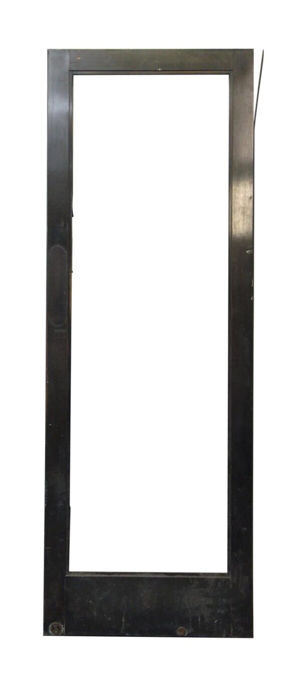 Tall black metal door with a full glass panel opening, shown with the glass area visible and the metal skin loose along one side.