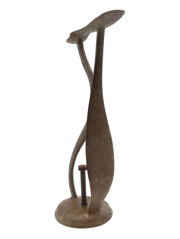 Antique bronze footrest with a curved stand, mounted on a round base with a visible screw at the bottom.