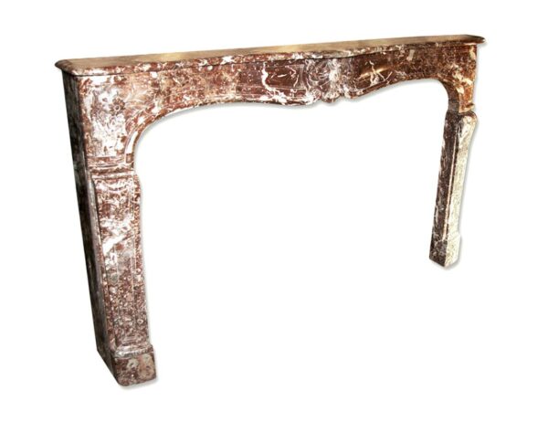 French Louis XV marble mantel with a serpentine apron and carved floral details.