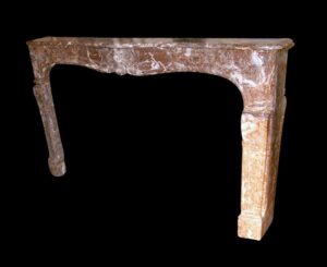 Louis XV marble mantel with a serpentine apron and carved floral details, shown in a front view.