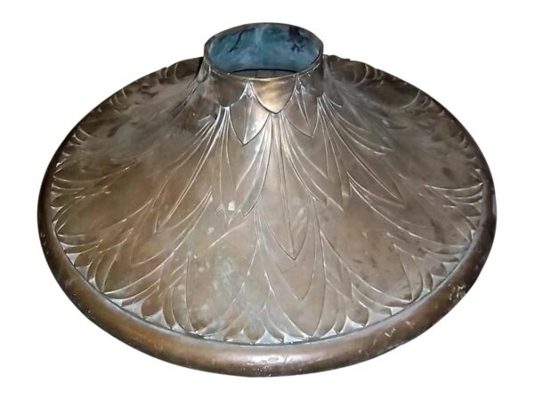 Antique bronze base with ornate leaf-like detailing and a wide circular form, shown from above.