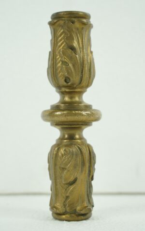 Bronze center support casting with acanthus leaf detail, shown in a vertical close-up view.