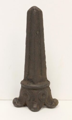 Art Deco cast iron finial with a pointed top and decorative base, shown upright on a plain background.
