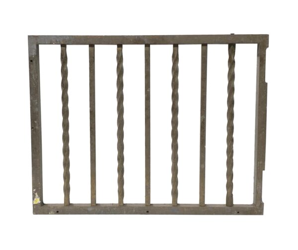 Brass bank teller gate with alternating twisted and straight spindles in an antique brass finish.