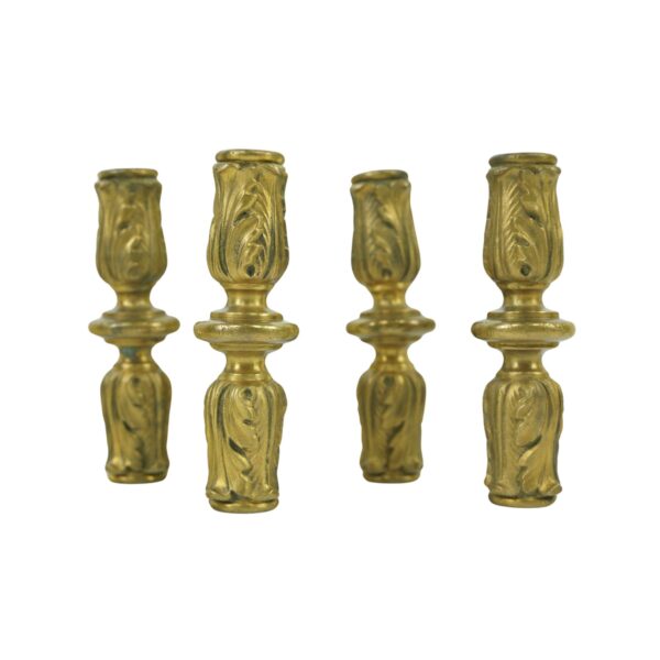 Set of four bronze center support castings with acanthus leaf detail, shown upright as a grouped product image.