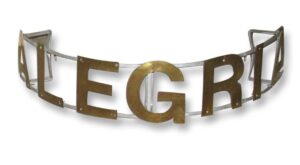 Curved metal sign with large brass letters on a steel frame, shown in a front view.