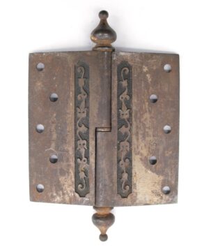 Victorian cast iron butt door hinge with steeple tips, two knuckles, and a staggered hole pattern shown front on.