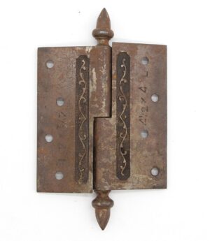 Victorian cast iron lift off butt door hinge with acorn tips and a staggered hole pattern.