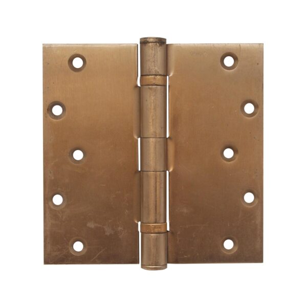 Vintage six-panel pine passage door in a medium wood tone, shown front on with a visible lock opening on the right side.