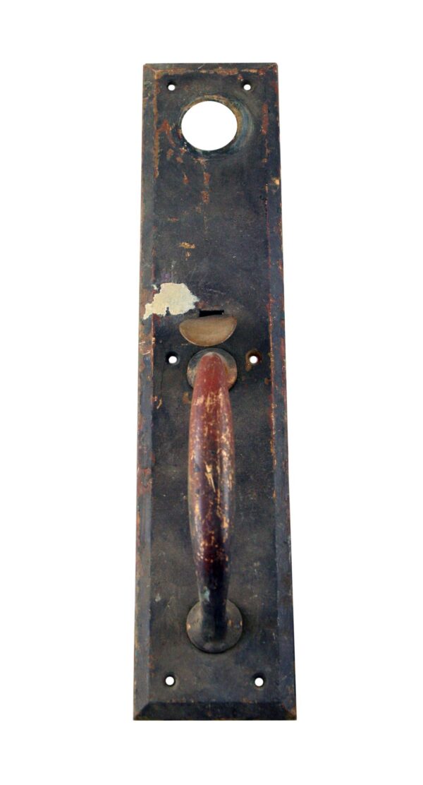 Antique bronze door pull with a lock insert, shown vertically with a thumb latch and circular grip on a rectangular backplate.