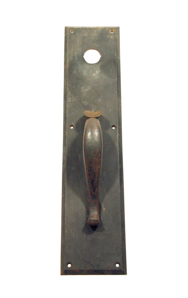 Antique bronze commercial door pull with a centered handle, thumb latch, and lock insert on a rectangular plate.