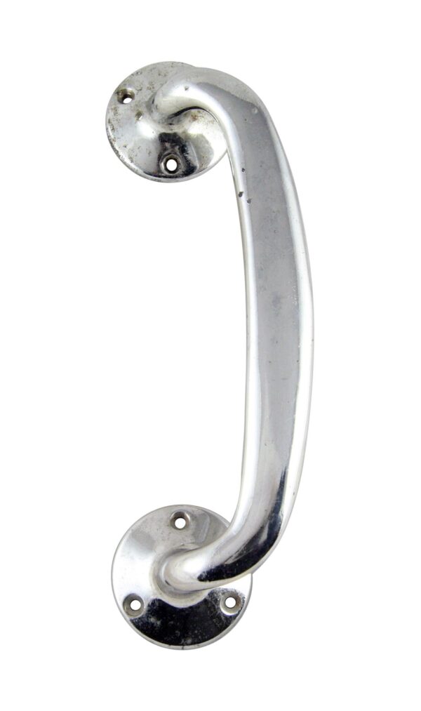 Chrome-plated door pull handle with circular mounting bases and visible screw holes, shown in a close-up view.
