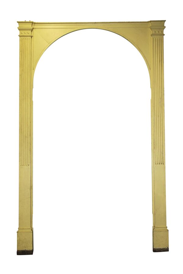 Yellow arched door surround with fluted side posts and decorative capitals, shown front-on as a tall entry arch frame.