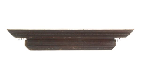 Carved mahogany door header with egg and dart detail and a dark wood tone, shown in a straight-on view.