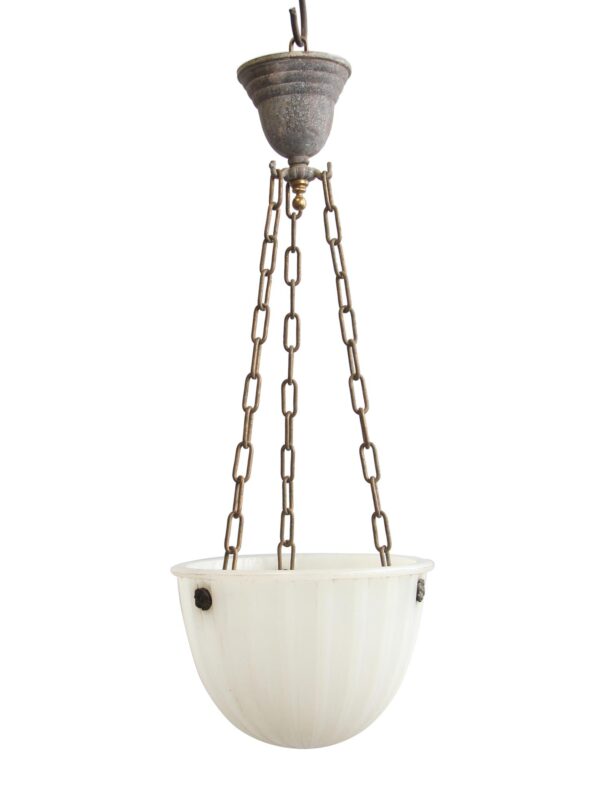 Pendant light with a fluted white milk glass bowl suspended by three chains and an antique brass fixture top.