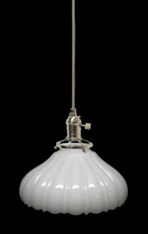 White milk glass pendant light with a fluted shade and polished nickel fitter, shown with a long cord.