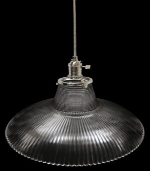 Clear prism glass pendant light with a fitted metal canopy and hanging cord, shown in a close-up view from below.