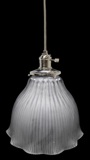Frosted glass pendant light with a hanging fitter and ribbed globe shade.